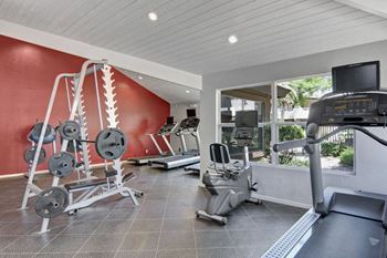24 Hr fitness center with cardio & weight equipment